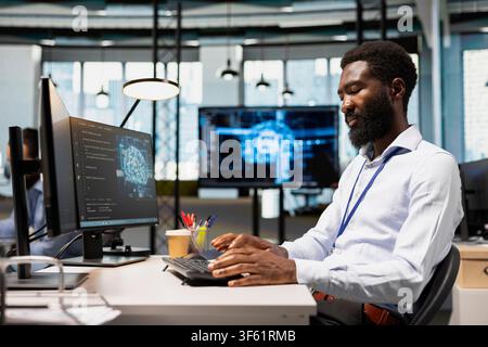 Programmer adjusting machine learning algorithms parameters at work to automate tasks. Tech startup employee using application, working with AI driven insights for code optimization Stock Photo