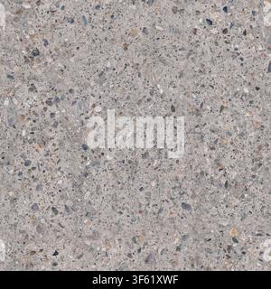 An overhead view of an exposed aggregate concrete surface showing embedded colorful gravel and pebbles. Stock Photo