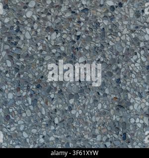 Top view of a washed aggregate concrete surface featuring densely embedded small stones and pebbles. Stock Photo