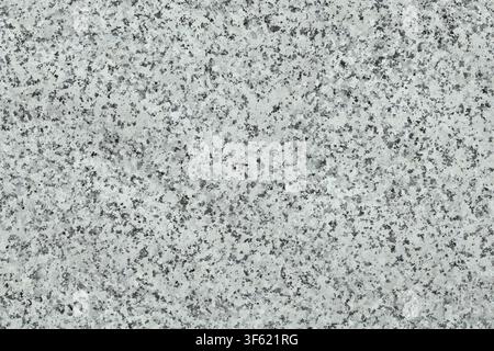 A horizontal surface texture of grey and white speckled granite rock. Stock Photo
