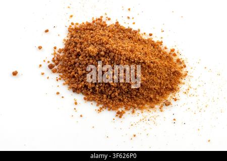 Brown Sugar Powder on Red Spoon Isolated Stock Photo