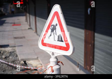 A construction site traffic sign stands on the roadside in Berlin ...