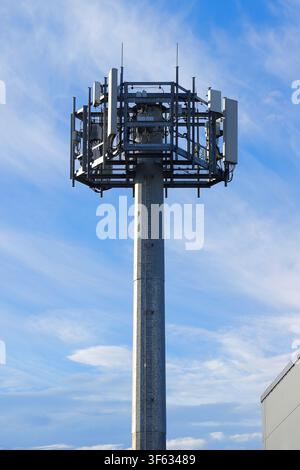 This is a cellular network transmission mast typically used for mobile and wireless telecommunications. Stock Photo