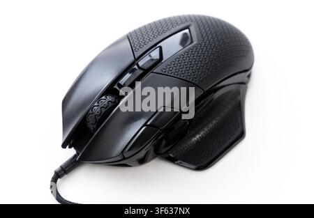 A closeup studio shot of a black wired gaming mouse on a white background Stock Photo