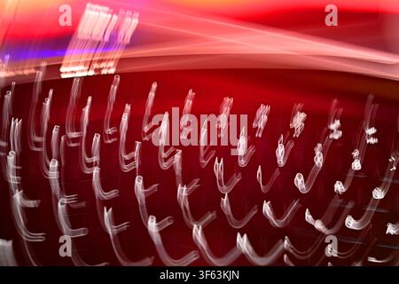 Abstract motion blur of a illuminated computer keyboard in front of a red background. ?SVEN SIMON Photo Agency GmbH & Co. Press Photo KG # Seidlhofstr.10 # 85540 Haar # GLS Bank IBAN DE75 4306 0967 4030 0251 00 # BIC GENODEM1GLS # www.svensimon.net Stock Photo