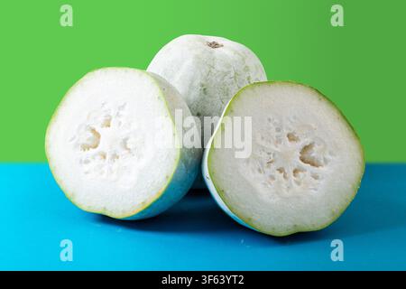 Whole and Half Fuzzy Winter Melon Isolated on Grey Background Stock Photo