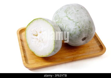 Whole and Half Fuzzy Winter Melon Isolated on Grey Background Stock Photo