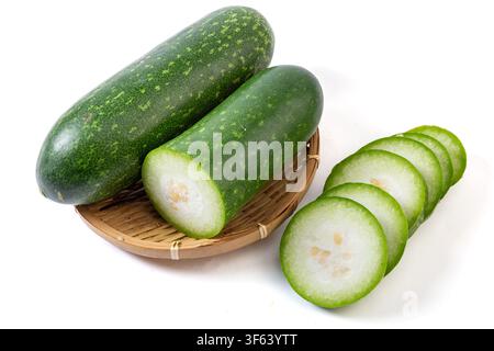 Whole and Sliced Small Green Wax Gourd Isolated on White Stock Photo