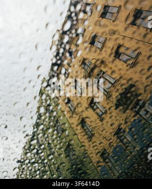 Czech Republic, Prague, building facade, view through a rain-streaked windowpane Stock Photo
