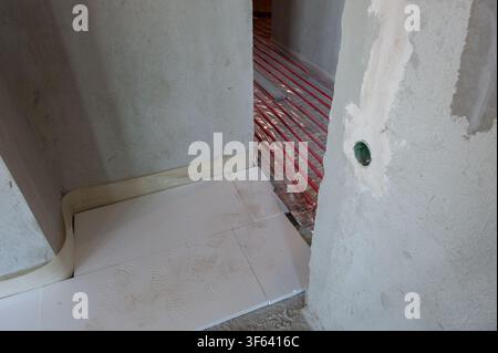 Underfloor surface heating pipes. Low temperature heating concept Stock Photo
