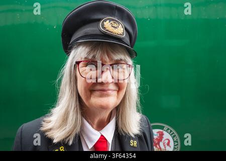 England, Hampshire, Alresford, Alresford Train Station, The Mid-Hants Heritage Railway aka The Watercress Line, Female Platform Guard Stock Photo