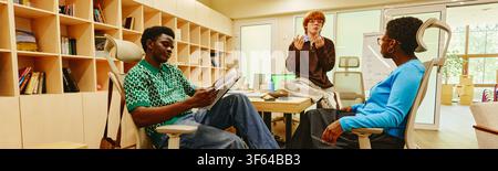 Diverse Colleagues Collaborating on Project in Modern Office Stock Photo