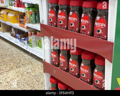 Nescafé Original instant coffee displayed on a supermarket promotion stand, illustrating grocery shopping and rising coffee prices in the UK. Stock Photo