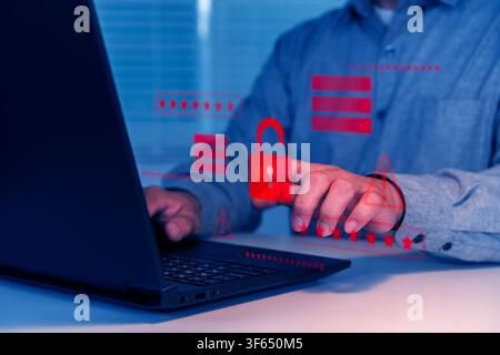 Close-up of a business user managing digital security on a laptop with password, alert and lock icons, suitable for cybersecurity, data protection, pr Stock Photo