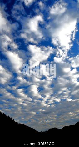 Altocumulus clouds or Mackerel sky over the Dyfi Valley Wales. Stock Photo
