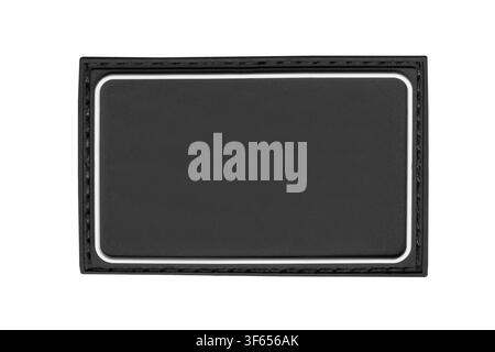 Black rubber blank stitched patch isolated on white background Stock Photo