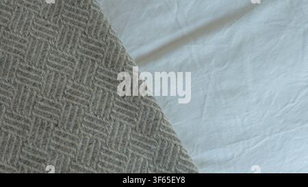 Grey Herringbone Wool Blanket Edge Against Crisp White Cotton Bed Linen — Textile Texture, Cosy Interiors and Neutral Background Concept Stock Photo