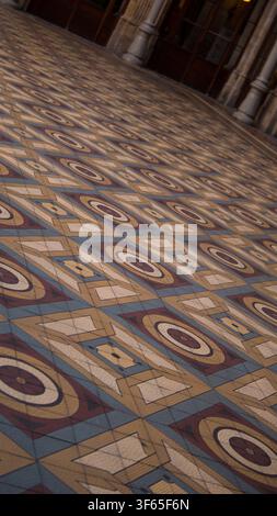 Antique Geometric Mosaic Tile Floor with Diamond and Rosette Pattern in Historic Palace Interior — Concept: Vintage Interior Design Stock Photo
