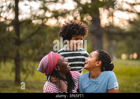 African American family bonding outdoors enjoying happy moments Stock Photo