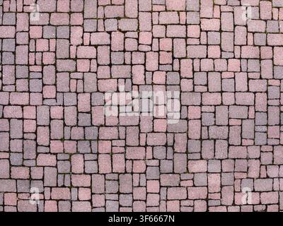 Top view texture of pink and grey concrete cobblestone pavement background Stock Photo