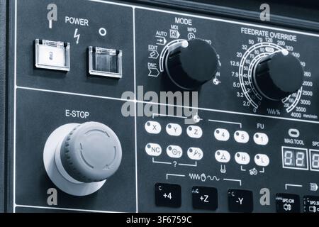 Control panel of modern metalworking machine tool equipped with buttons designed in style of keyboard, with labeled keys. tech industrial technology b Stock Photo