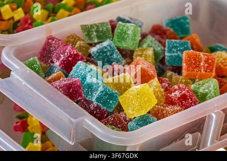 Large pile of colourful sugar jelly sweets sold on local market fair Stock Photo