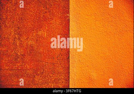 Abstract orange and red textured surface with a strong vertical division and digitally enhanced colors, creating a bold background for creative design Stock Photo