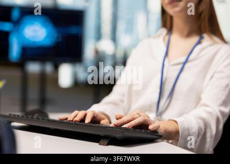 Close up of IT specialist using AI LLM assistant to review code file for glitches. Software developer using artificial intelligence to suggest optimizations and speed up application performance Stock Photo