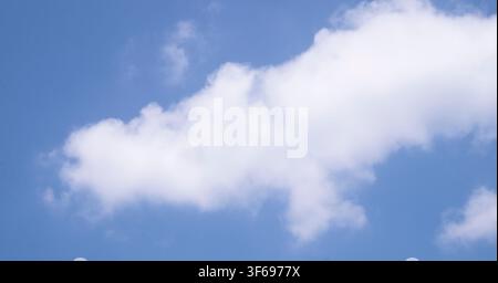 Single White Cloud In Blue Sky Nature Background Stock Photo