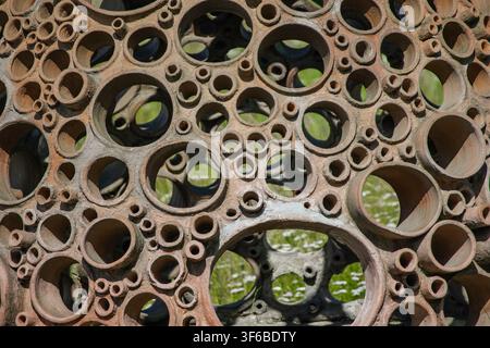 Rusty metal grate texture with a woven pattern, close-up of weathered industrial surface Stock Photo Stock Photo