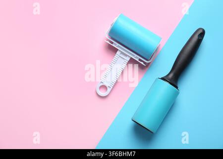 Different lint rollers on color background Stock Photo