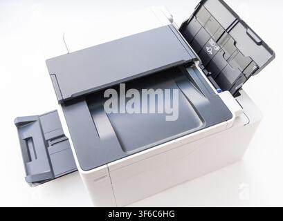 A modern office laser printer is isolated on a clean white background Stock Photo