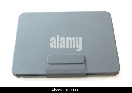 A closed grey tablet case is shown isolated against a clean white background Stock Photo