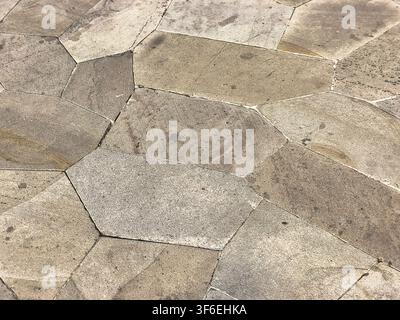 Irregular natural stone tile pavement texture background for floor or walkway Stock Photo