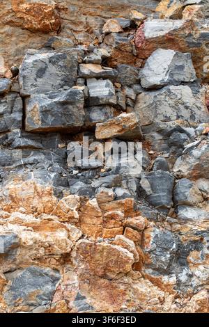 Natural Rough Slate and Granite Rock Texture Background with Brown Mineral Layers Stock Photo