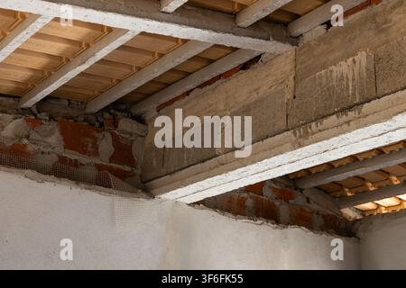 Close-up view of building materials and structural elements in an under-construction interior space Stock Photo