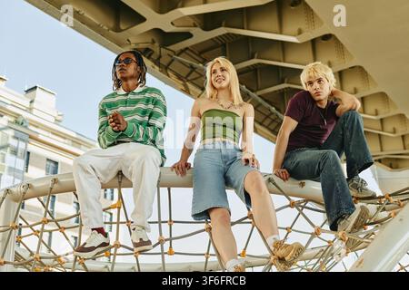 Diverse People Sitting Outdoors on Playground Structure Stock Photo