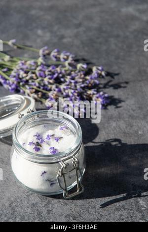 Lavender sugar in glass jar with fresh lavender flowers Stock Photo