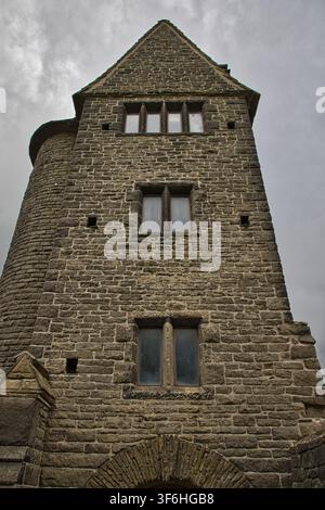 Low angle view of the stone Pigeon Tower at Rivington, Lancashire, UK, highlighting the Grade II listed architecture and mullioned glass windows. Stock Photo