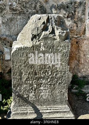 Stone Roman Inscription on Crumbled Pillar (Perge, Turkey) Stock Photo