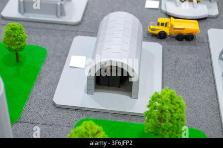 Model of arched shelter printed on 3D printer from molten plastic. Modular design for the protection of critical facilities or personnel created 3D printer. 3D printed scale model mock-up of modular Stock Photo