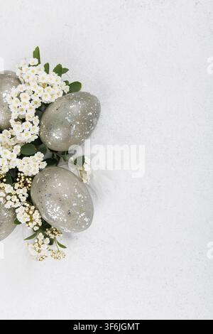 Speckled easter eggs floral border minimal composition Stock Photo