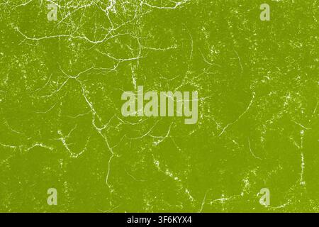 Lime Green Cracked Grunge Texture Background. Bright lime green surface with white cracks, scratches and distressed details. Abstract grunge texture Stock Photo