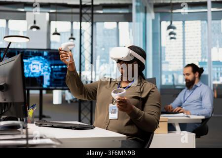 Software developer using virtual reality tech, automating repetitive tasks with AI scripts. IT expert wearing VR gear using artificial intelligence to speed up feature implementation Stock Photo