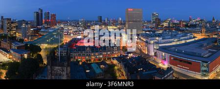Aerial Image of Manchester Cathedral, Corn Exchange, Urbis, and City Centre at Twilight Stock Photo