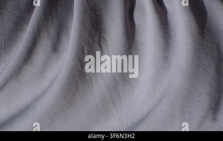 Light Gray Wrinkled Fabric Texture Background Close Up Stock Photo