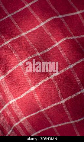 Red Checkered Fabric Texture Background With Diagonal Folds Stock Photo