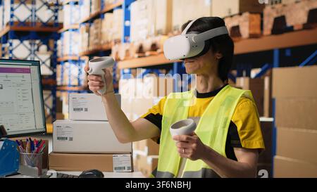 Worker in hi vis vest uses a VR headset connected to AI for hands free inventory control, parcel shipment tracking and order fulfillment. Virtual reality improves fast delivery. Camera B. Stock Photo
