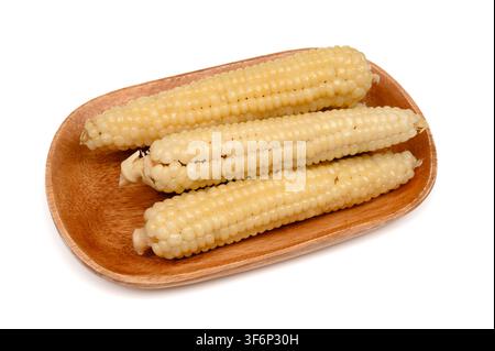 Steamed sweet corn cobs on a wooden tray Stock Photo