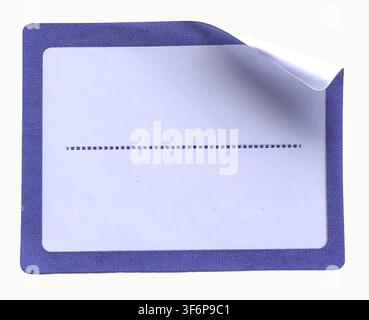 Blank blue paper adhesive sticker label with curled corner isolated on white background sticky note tag mockup for design and text Stock Photo